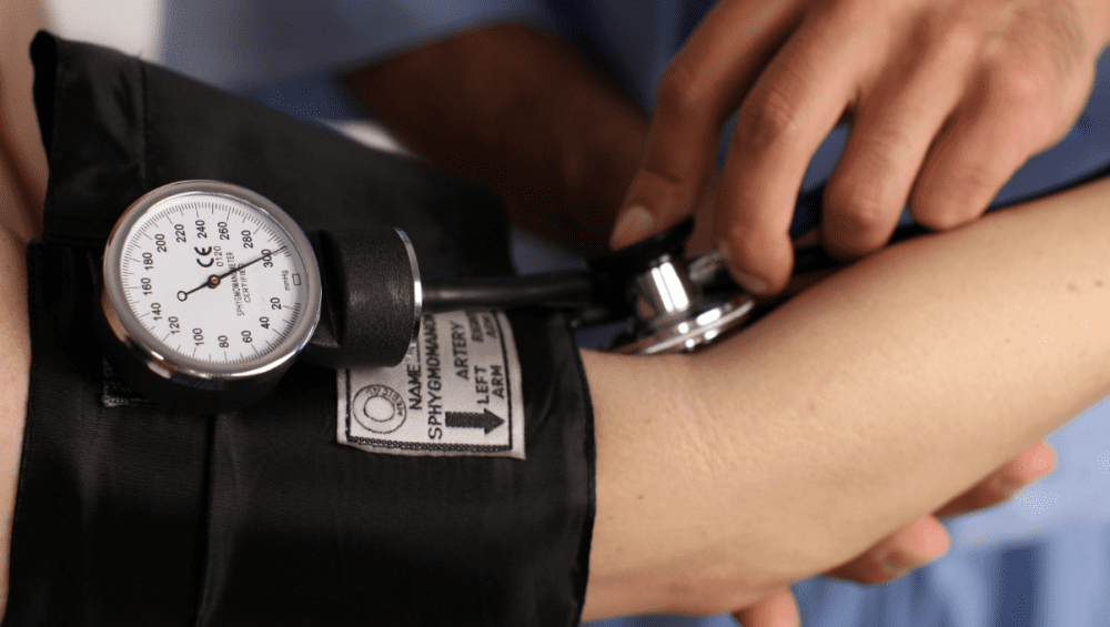 blood pressure cuff on arm