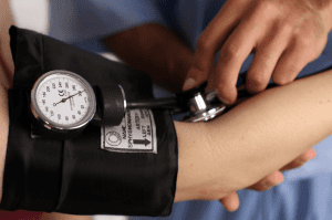 blood pressure cuff on arm